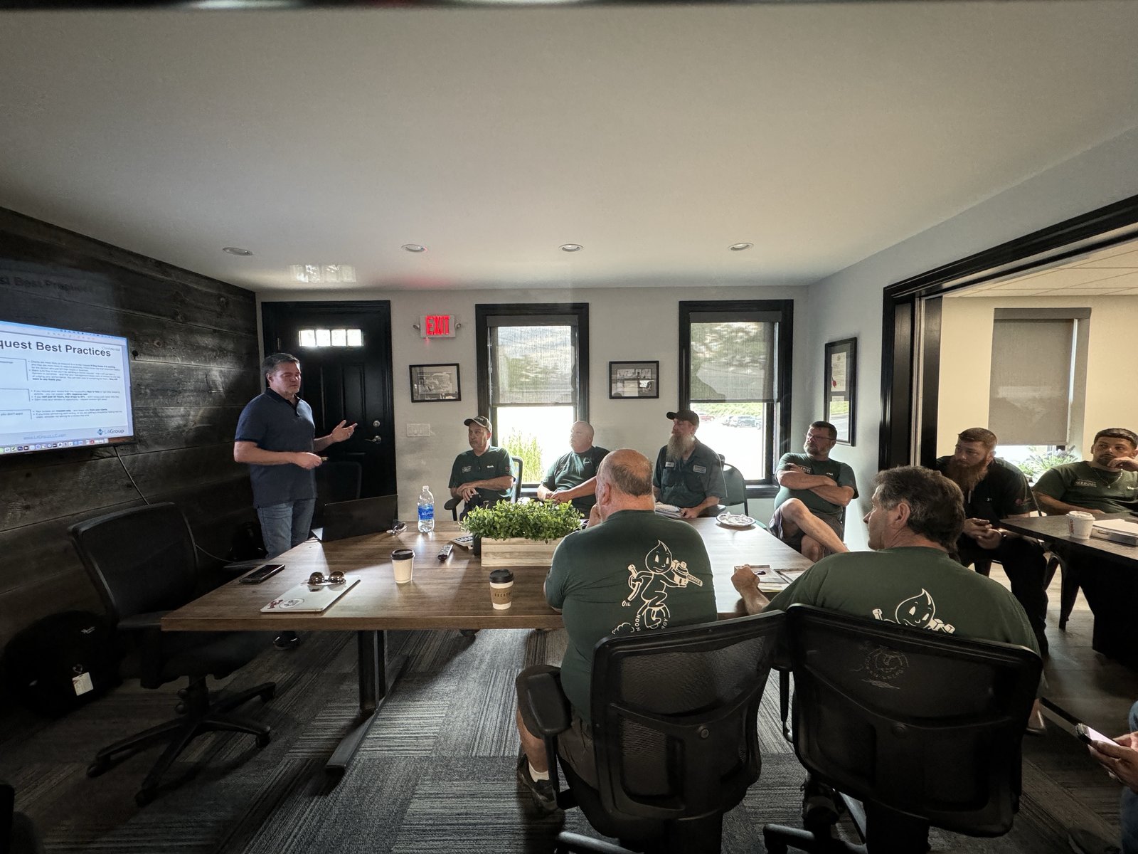 Brett Lewis training a room of client field technicians on review request best practices