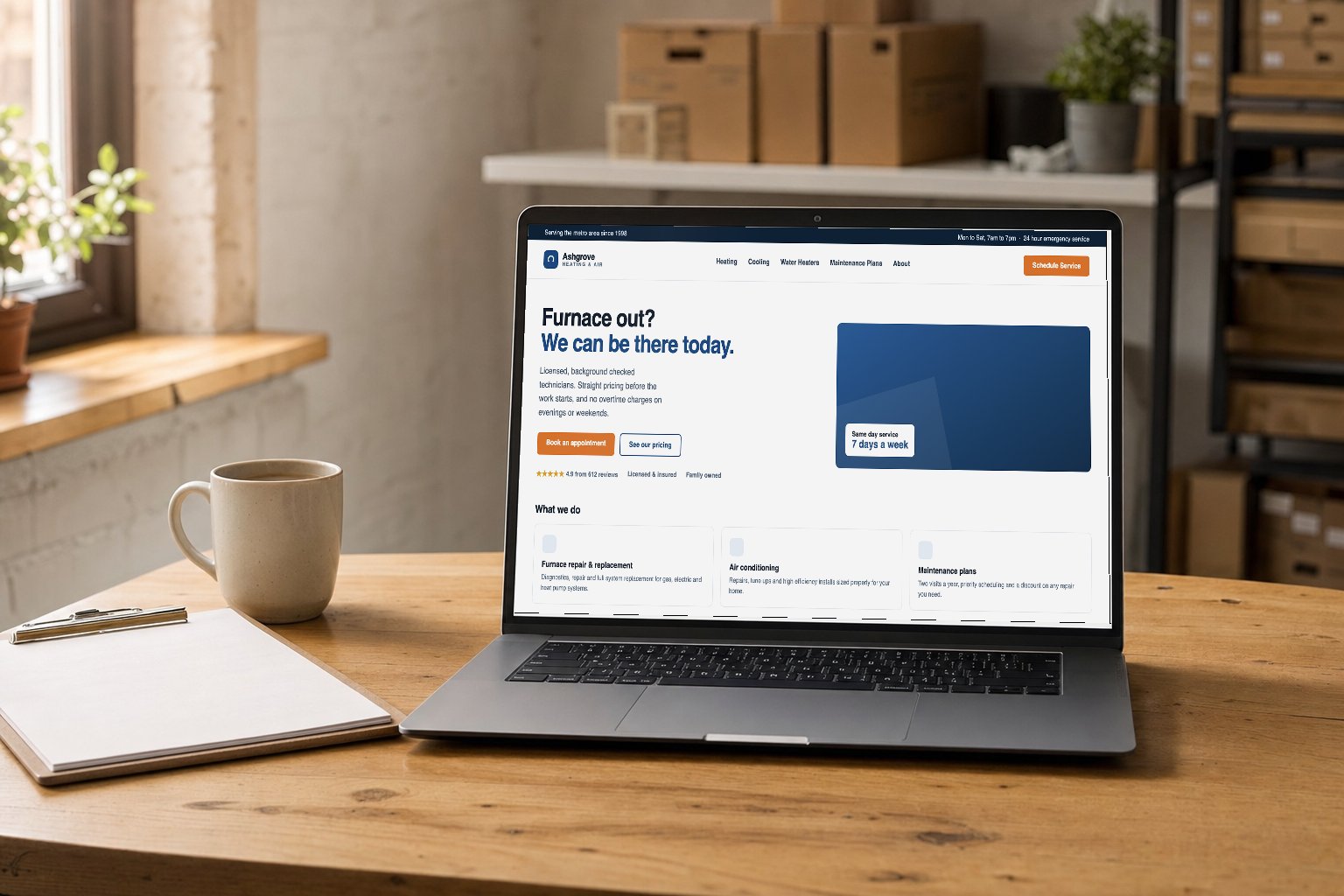 A laptop on a workbench showing a clear, well built HVAC company website with service pages and a booking button